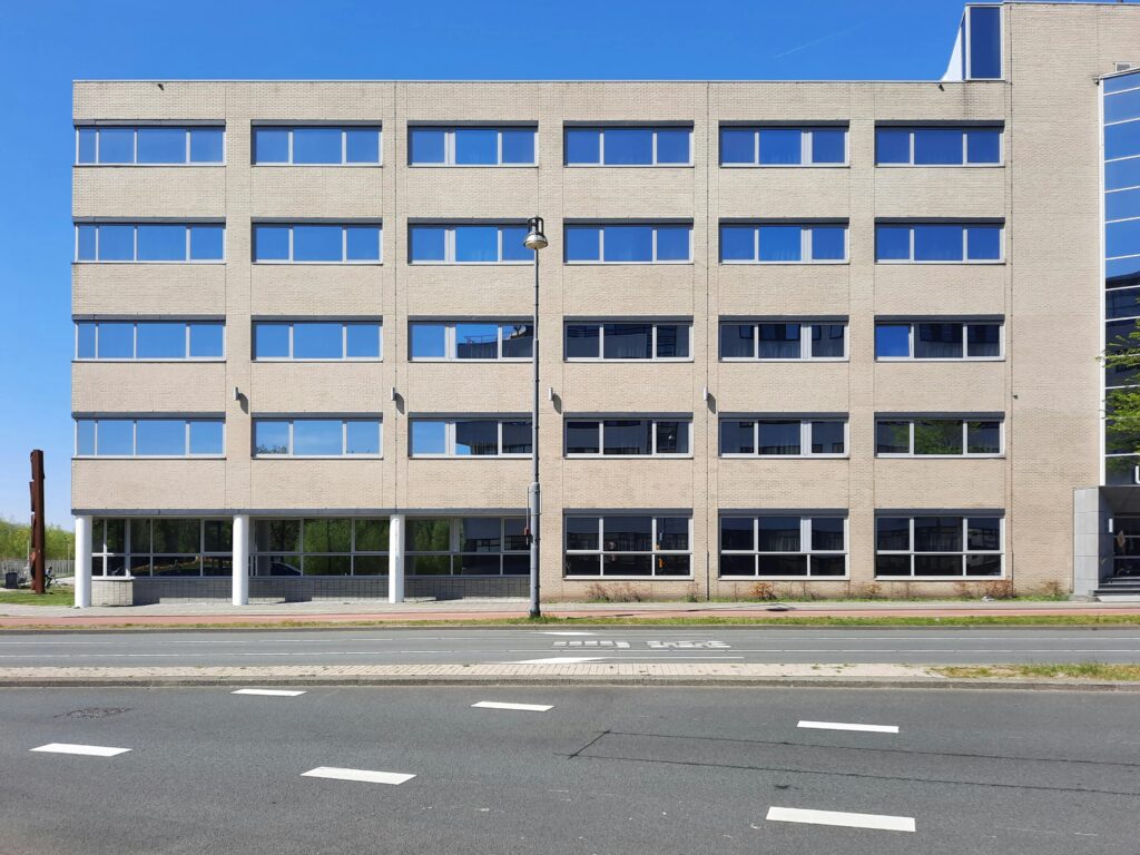 Symmetrical facade of a modern office building located in Amsterdam, Netherlands.